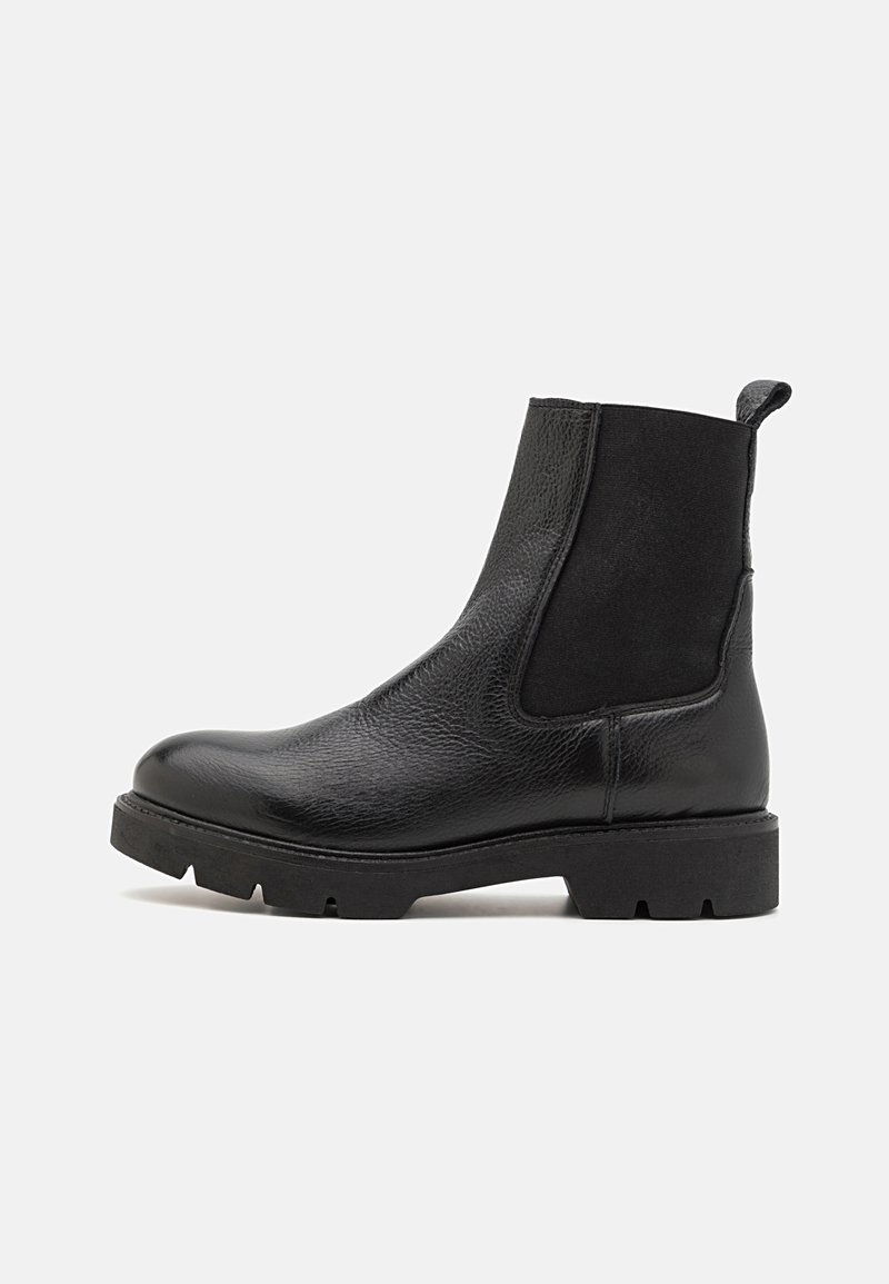 Black ankle boots with smooth leather and elastic side panels. Textured toe, chunky rubber sole with treaded pattern, and pull tab at the back.