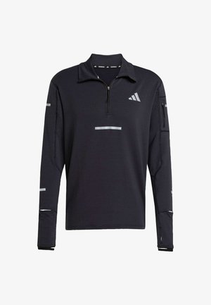 Musta urheilupullover, jossa on neljännesvetoketju, teksturoitu kangas, heijastavat yksityiskohdat ja vetoketjullinen tasku hihassa. Sisältää korkean kauluksen.