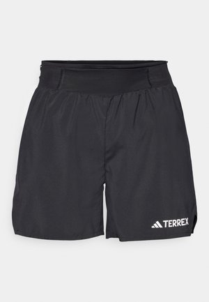Pantalones cortos deportivos negros con una cinturilla elástica, hechos de tejido liviano. Presenta un logo blanco de "TERREX" en la parte inferior izquierda.