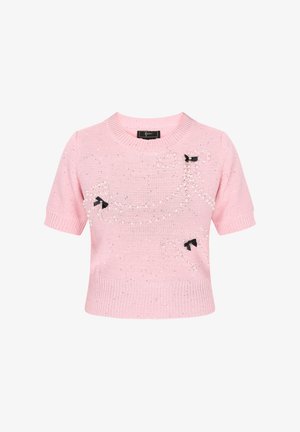 Pink short-sleeve sweater made of knit fabric, featuring silver embellishments and black bow accents. Ribbed neckline and hem details.