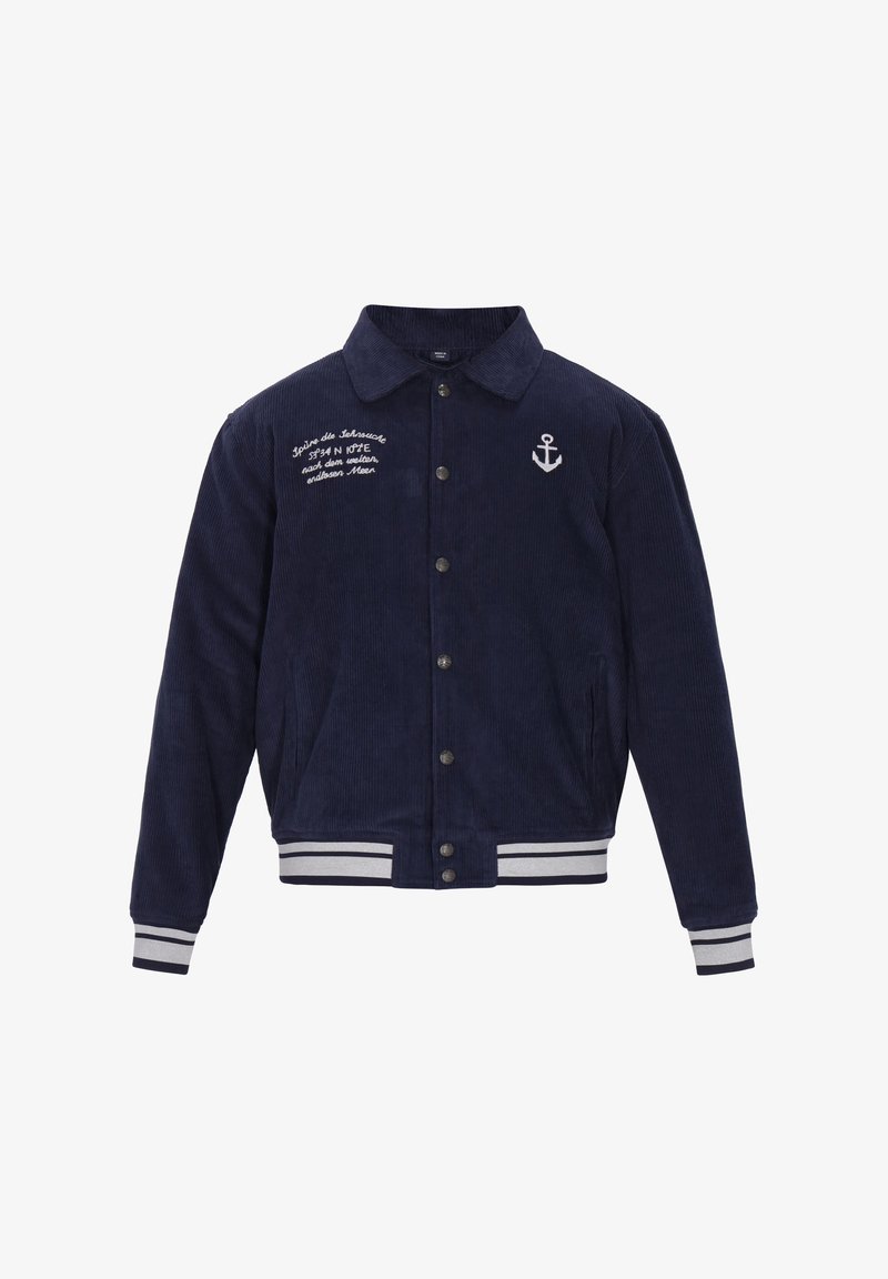 Marineblå kordjakke med knaplukning, spidse krave, broderet ankerdetalje, hvide striber ved manchetterne og kanten samt sidelommer.