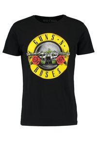 Sort bomulds T-shirt med en stor gul cirkulær grafisk illustration med et skelet, røde roser og teksten "GUNS N' ROSES" i sort.