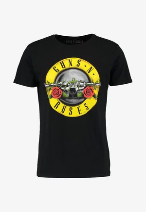 Schwarzes Baumwoll-T-Shirt mit einem großen gelben kreisförmigen Grafikdesign, das einen Totenkopf, rote Rosen und den Text "GUNS N' ROSES" in Schwarz zeigt.