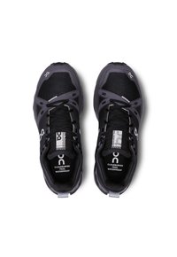 Black waterproof trail running shoes with a textured mesh upper, reinforced accents, and reflective detailing. Features logo and lacing system.