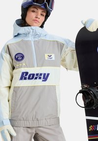 Lichte, meerkleurige snowboardjack met een capuchon, rits aan de voorkant, Roxy-logo en elastische manchetten. Glad materiaal met een ontspannen pasvorm.