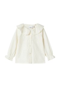 Blusa per bebé a maniche lunghe in crema con colletto Peter Pan scollato a onda, pattern floreali ricamati, chiusura anteriore con bottoni e polsini elasticizzati con volant.