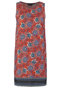 Robe orange sans manches avec un motif floral bleu et blanc et une bordure noire au bas.