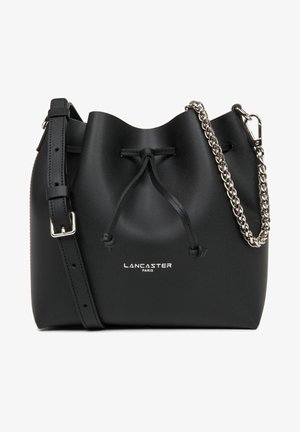 Black leather bucket bag with a drawstring closure, silver chain accent, and adjustable strap. Features "Lancaster Paris" logo on the front.