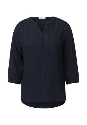Marineblauw, lange mouwen top met een textuur en gekreukeld patroon. Kenmerkt zich door een V-hals, drie knopen bij de hals en een ronde zoom.