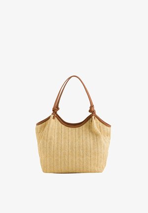 Sac cabas tissé beige avec garniture en cuir marron et doubles poignées, présentant une forme souple et décontractée.