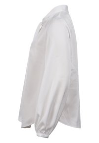 Weiße Bluse mit langen Ärmeln und Kragen, mit lockerem Schnitt und gerafften Bündchen. Hergestellt aus glattem, weichem Stoff mit minimalen Nähten.