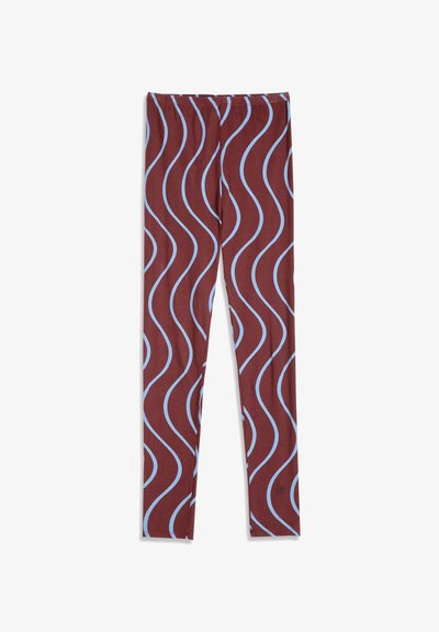 Legging avec une couleur de base marron et un motif répétitif de lignes ondulées bleu clair, avec une taille élastique et une coupe ajustée.