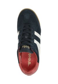 Navy suede sneaker with white stripes, padded tongue, and red interior. Features a rubber sole and logo detail on the side.