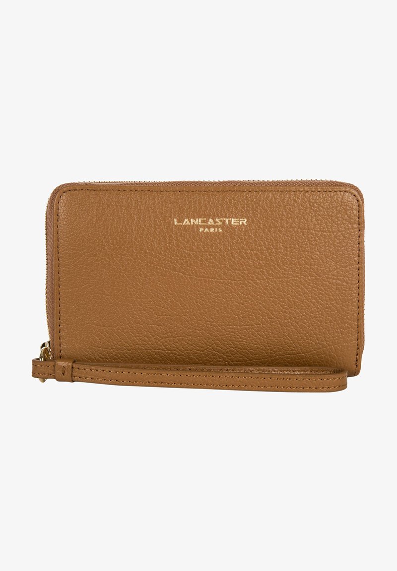 Tan leather wallet with a textured finish, gold embossed "LANCASTER PARIS" logo, zip closure, and attached wrist strap.