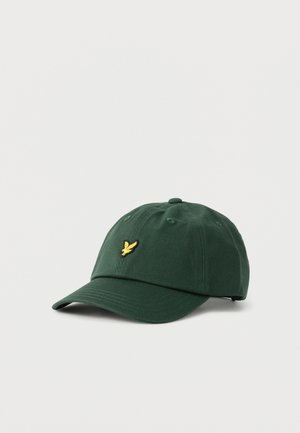 Casquette de baseball vert foncé à visière courbée avec un petit logo d'oiseau jaune brodé sur le panneau central avant.