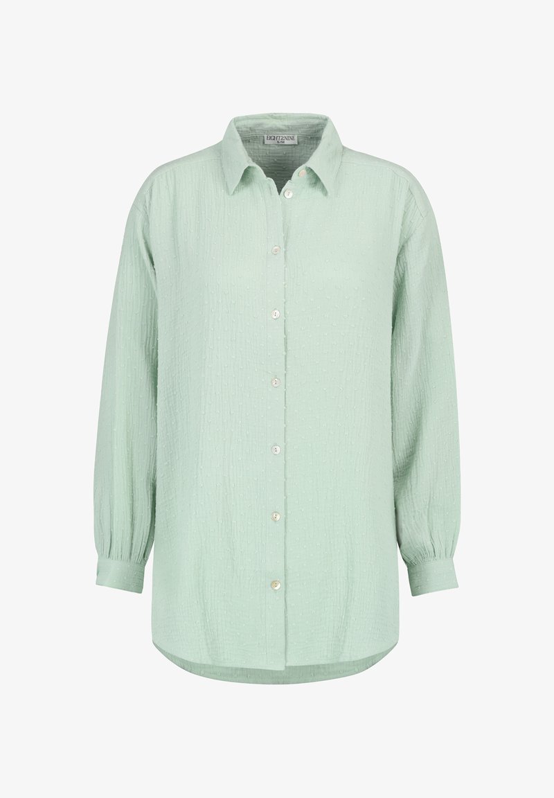 Hellgrünes, langärmeliges Hemd mit Knöpfen aus strukturiertem Stoff, ausgestattet mit einem Hemdkragen und einem abgestuften Saum mit fünf Knöpfen.