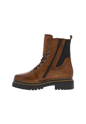 Botte montante en cuir marron avec fermeture à lacets, fermeture éclair latérale, panneau élastique noir, languette de traction et semelle épaisse en caoutchouc noir.