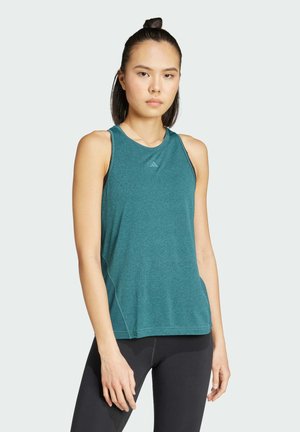 Turquoise sportieve tanktop met een ronde halslijn, zachte textuur en contrasterende stiksels. Bevat het Adidas-logo op de borst.