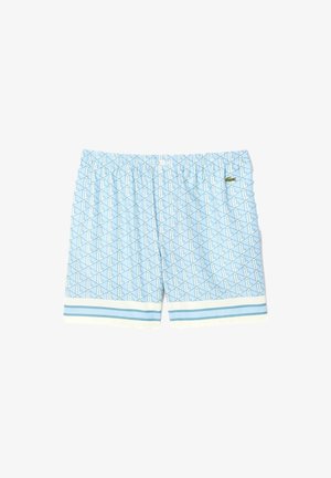 Shorts de bain bleu clair avec un motif géométrique, taille élastique et accents rayés à l'ourlet. Logo Lacoste à l'avant.