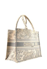 Sac fourre-tout beige et gris Christian Dior avec des motifs d’animaux de la jungle et floraux, et des anses doubles rembourrées.