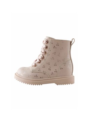 Beige lace-up ankle boot with cherry pattern, satin ribbon laces, and a rugged sole, shown from the side.