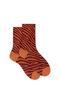 Calze arancioni con un motivo a strisce di tigre in tonalità di marrone scuro. Presentano punte e talloni rinforzati. Tessuto morbido, con bordo a coste per una vestibilità perfetta.