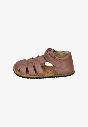 Brown leather toddler sandal with multiple straps, hook-and-loop closure, cork sole, and "koel" embossed on the heel area.