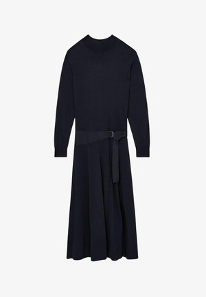 Villakangas-sekoite, pitkähihaista mekkoa tummansinisessä värissä, jossa on istuva vartalonmyötäinen yläosa, levenevä hameosa ja yhteensopiva vyö, jossa on pyöreä solki.