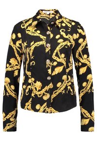 Svart långärmad skjorta med knappar, dekorerad med ett mönster av gyllene snäckor, sjöstjärnor och kedjor, med spetskrage och prydnadsknappar.