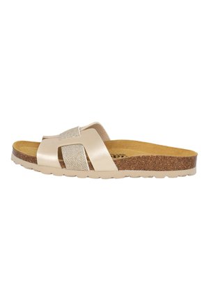 Beige slide sandal with shiny strap, cork sole, and textured footbed; features cross straps and a contoured design for comfort.