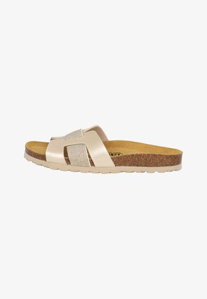 Beige slide sandaal met glanzende band, kurken zool en gestructureerde voetbed; heeft kruisbanden en een gebogen ontwerp voor comfort.
