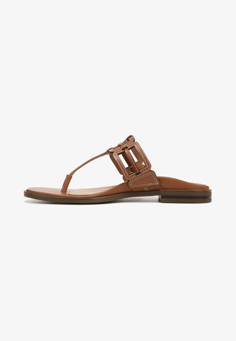 Brown leather thong sandal with a flat sole, featuring a square buckle accent and subtle stitching along the edges.