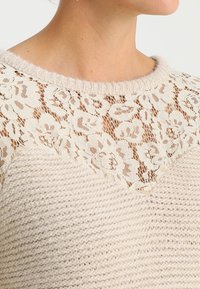 NAF NAF Stickad tröja - beige