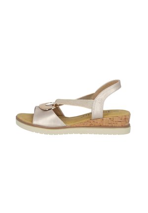 Wedge sandal with a cork heel, metallic gold leather upper, open toe design, and adjustable ankle strap featuring a decorative circular hardware.