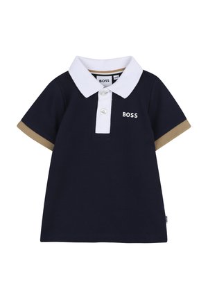 Polo pour bébé bleu marine avec col blanc, deux boutons, bordures de manches beiges et logo "BOSS" sur la poitrine et l'étiquette latérale.