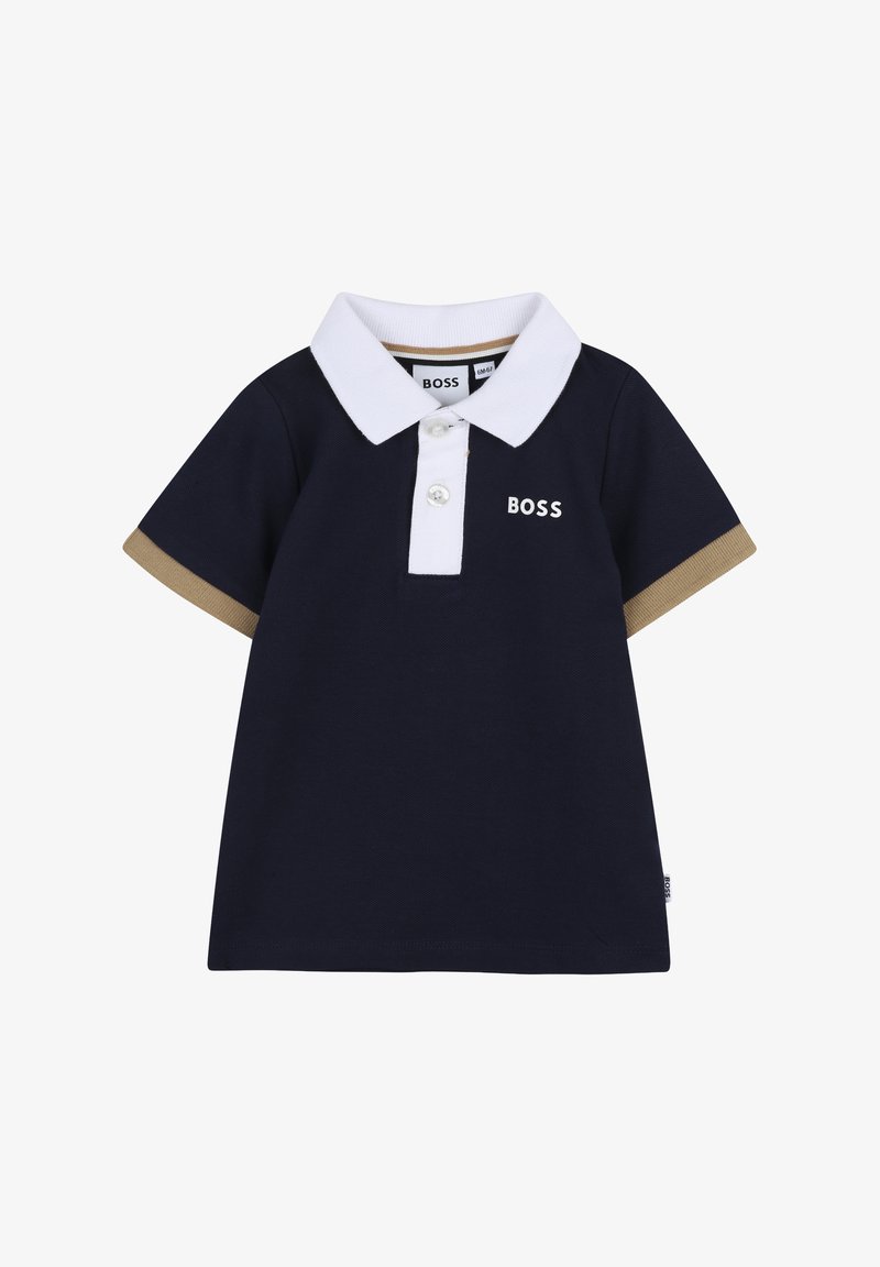 Polo pour bébé bleu marine avec col blanc, deux boutons, bordures de manches beiges et logo "BOSS" sur la poitrine et l'étiquette latérale.