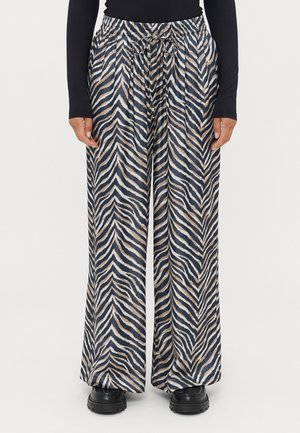 Wide-leg pants in a zebra pattern, featuring navy, beige, and white stripes. Made of lightweight fabric with an elastic waistband and drawstring.
