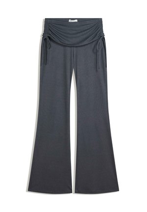 Pantalons large gris foncé avec taille élastique froncée et liens latéraux ajustables, fabriqués en tissu côtelé doux.