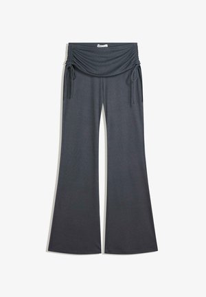 Pantalons large gris foncé avec taille élastique froncée et liens latéraux ajustables, fabriqués en tissu côtelé doux.