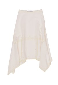 White asymmetrical skirt with yellow embroidery, textured fabric, and scalloped edges. Features decorative stitching and dotted accents.