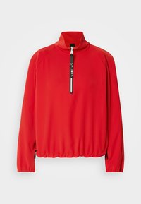 Rode long sleeve pullover met hoge kraag, halve rits aan de voorkant, elastische zoom en zijritsen. Gemaakt van soepel, lichtgewicht stof.
