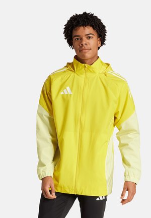 Geel waterdichte jas met witte accenten, front-rits, verstelbare capuchon en elastische manchetten. Bevat het Adidas-logo op de borst.