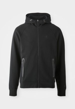 Črna zip-up jopica iz mehkega materiala, z kapuco, raglan rokavi, dvema žepoma na zadrgo in majhnim logotipom na prsih.