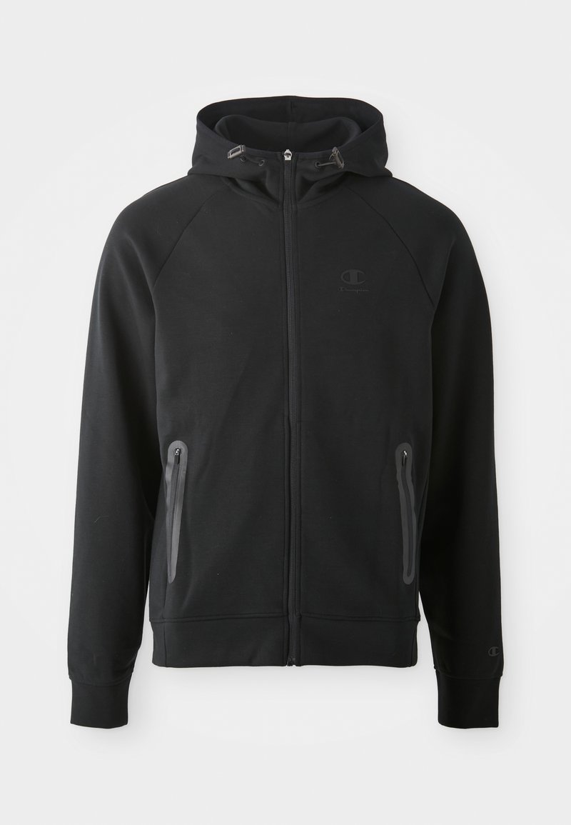 Schwarze Zip-Hoodie aus weichem Stoff, mit Kapuze, Raglanärmeln, zwei mit Reißverschluss versehenen Taschen und einem kleinen Logo auf der Brust.