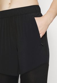 Nike Performance W NK DF RUN - Treniņtērpa apakšdaļas - black/reflective silver