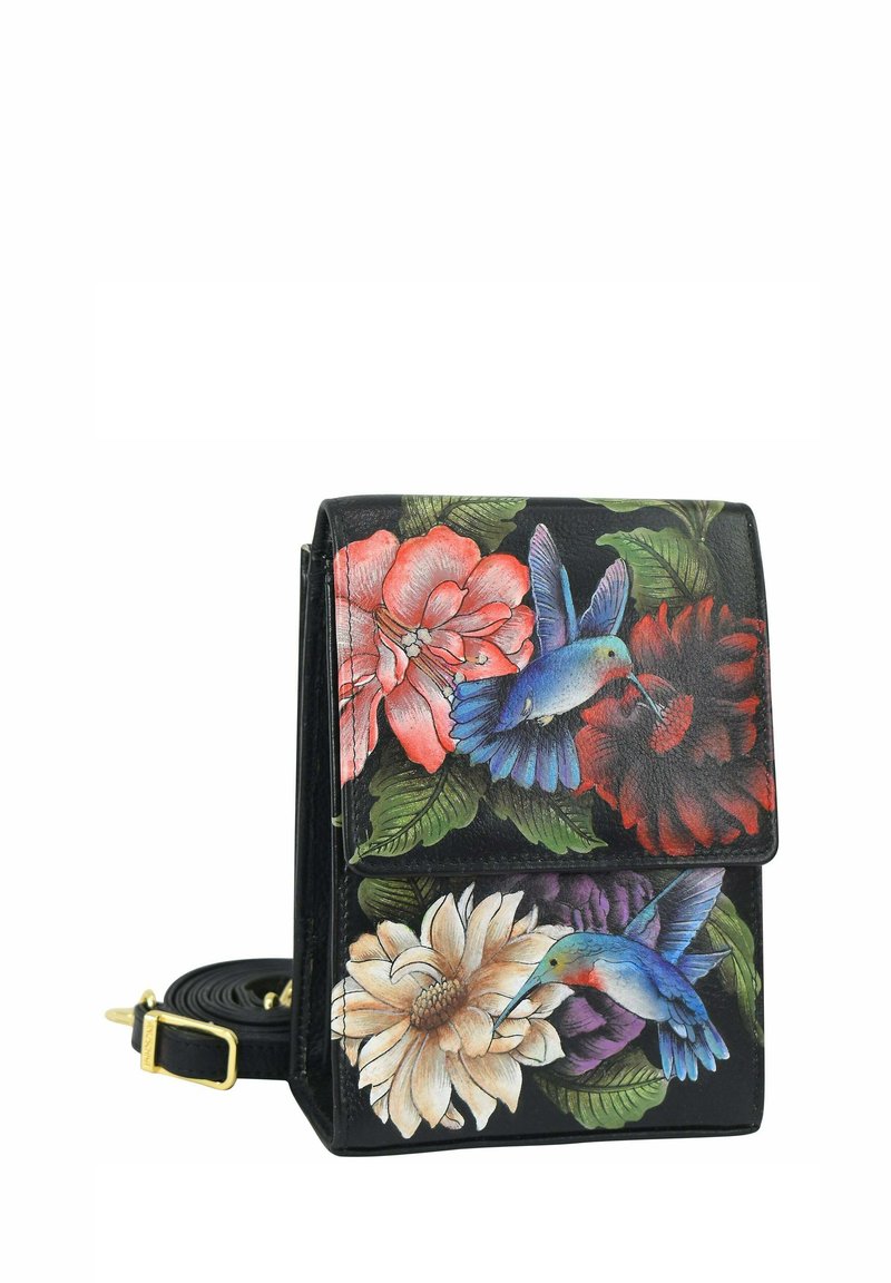 Schwarze Lederhandtasche mit floralen und Kolibri-Designs, mit strukturiertem Format, Klappenverschluss und verstellbarem Tragegurt.