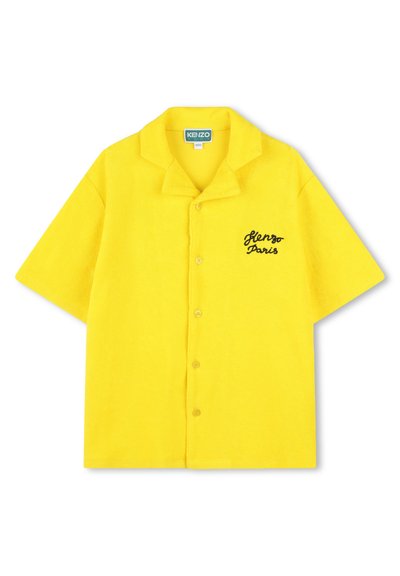 Korte mouwen, overhemd met knopen in felgele terrystof. Kenmerkt zich door een puntige kraag en "Kenzo Paris" geborduurd in het zwart op de borst.