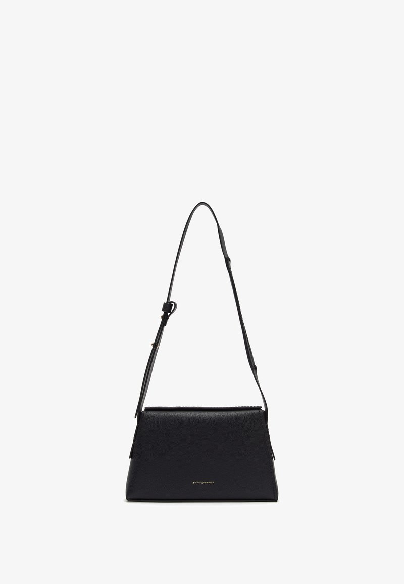 Black leather handbag with a structured shape, adjustable strap, and subtle logo detail at the front. Smooth texture with zip closure.