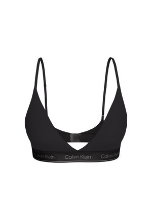 Bralette negro de Calvin Klein con tirantes finos ajustables y banda elástica con la marca bajo el busto, sobre un fondo blanco.