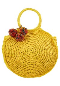 żółta pleciona torba ze słomy o okrągłym kształcie, z fakturowaną powierzchnią i dekoracyjnymi, wielokolorowymi pomponami przymocowanymi do uchwytu.